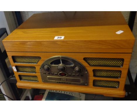 A Crosley wood cased CD, Record and Tape player