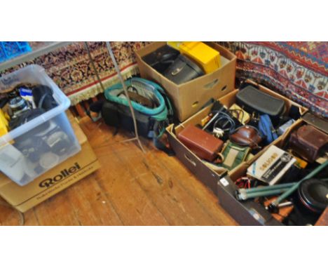 Four crates of assorted 35mm cameras, camera bodies, lenses, accessories and slide projectors, etc.