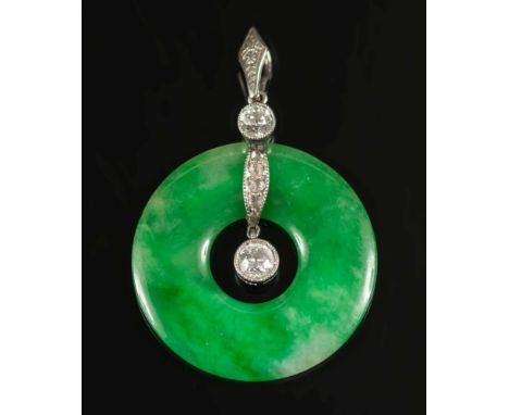 A jade and diamond pendant:, the green jade disc approximately 26mm diameter with diamond-set suspension loop. 

*Not tested 