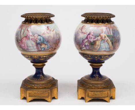 A pair French porcelain and gilt brass mounted cassolettes: each of pedestal ogee form with pierced rim set on a canted squar