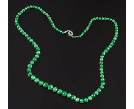 A graduated green jade bead single string necklace:, the beads graduated from 3.6mm - 9.6mm diameter, with an emerald and dia