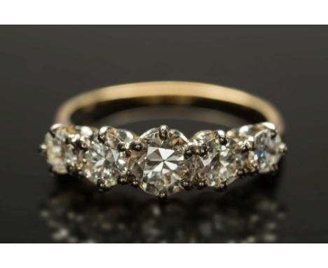 A diamond five-stone ring: with graduated circular, brilliant-cut diamonds approximately 0.20ct, 0.25ct, 0.50ct, 0.25ct and 0