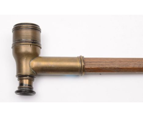 A 19th century novelty walking stick: the handle in the form of a two-draw monocular telescope, stamped Rolland, London, on a