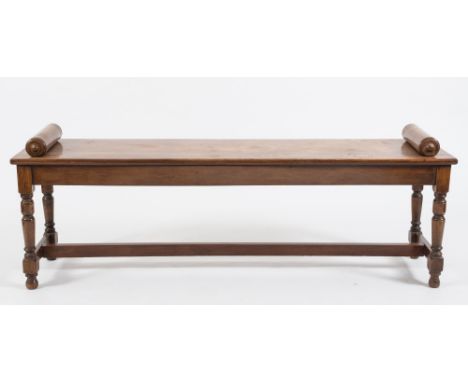 A Victorian mahogany rectangular bench seat:, with scroll ends on turned tapered legs, united by plain stretchers, 151cm (4ft