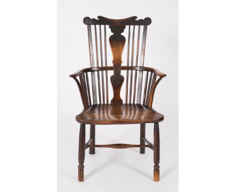 An early 19th Century elm and fruitwood comb back Windsor elbow chair:, the stick back with a shaped top rail and solid vase 