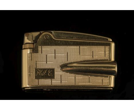 A 9ct gold 'Ronson' cigarette lighter: engraved with initials and with engine-turned decoration. 