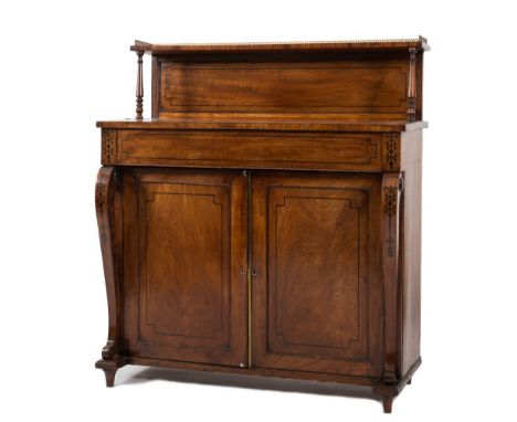 A Regency mahogany and inlaid chiffonier:, bordered with ebony lines, the shelved and panelled superstructure with a brass th