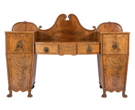 A Regency Scottish mahogany and inlaid pedestal sideboard:, of bowed breakfront outline, bordered with ebonised lines, the sh
