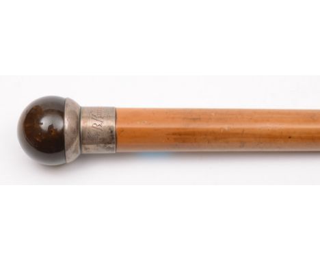 A Victorian gentleman's walking stick: the malacca cane with silver mounted collar and polished cat's eye agate pommel, 101cm