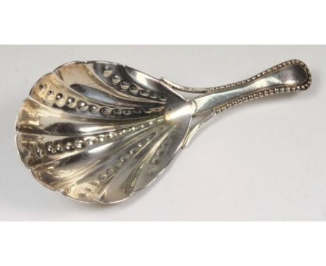 A  silver caddy spoon, maker WB: the shell shaped bowl with beaded handle, 8.25cm. long, 0.45ozs.