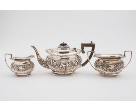 An Edward VII silver three - piece tea service, maker George Nathan & Ridley Hayes, Chester 1905: of barge shaped outline, wi