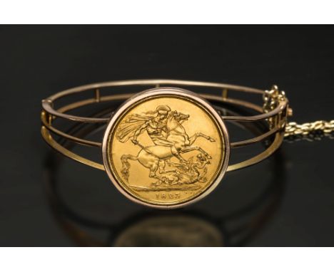 A George IV  two pounds dated '1823', swivel mounted as a hinged bangle:.