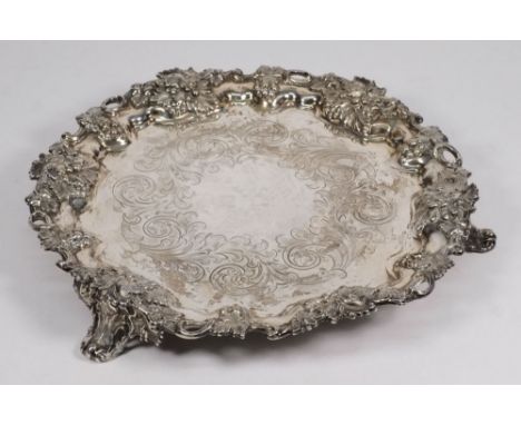 A Victorian silver salver, maker Henry Wilkinson and Co, Sheffield 1877: of circular outline, the centre engraved with foliat