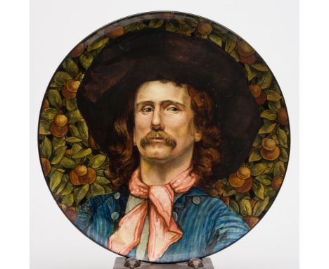 A large Doulton Lambeth faience plaque: of circular form painted by Katherine Sturgeon with a head and shoulders portrait of 