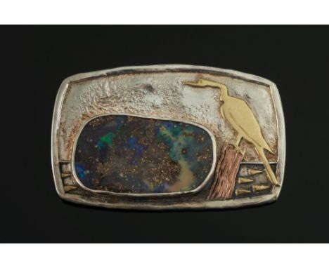 A boulder opal mounted rectangular brooch by Charmian Harris:, the rounded rectangular panel with applied cormorant motif and