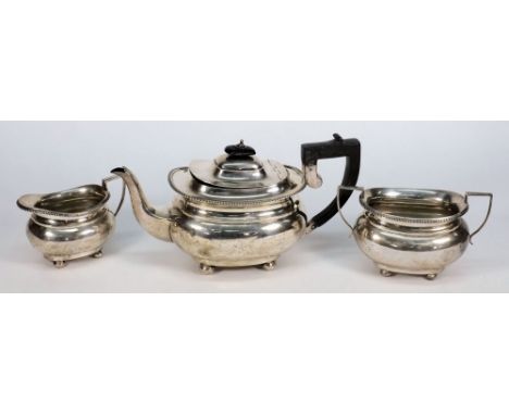 A George V silver three-piece tea service, maker Herbert Edward Barker & Frank Ernest Barker, Chester 1918:, of barge shaped 