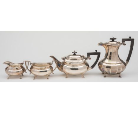 A George V silver four-piece tea service, maker J.S, Sheffield, 1921: of faceted oval form raised on swept pad feet, includes