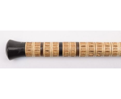 A shark's vertebrae walking stick: with ebonised pommel, 87cm. long