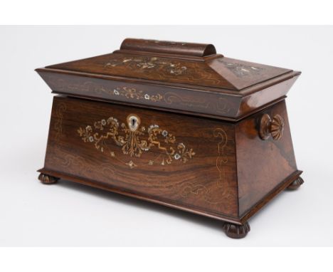 A Regency rosewood and mother-of-pearl inlaid tea caddy: of sarcophagus outline, the domed hinged lid enclosing two lidded ca