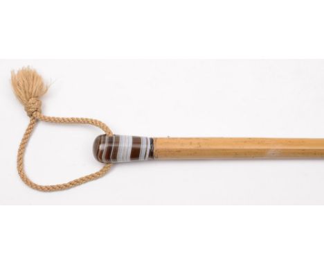 A 19th century lady's walking stick: the malacca shaft with polished banded agate pommel, 81.5cm. long.