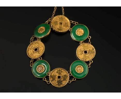 A Chinese gold and green jade disc panel mounted bracelet:.

(Jade not tested for natural colour or enhancements)