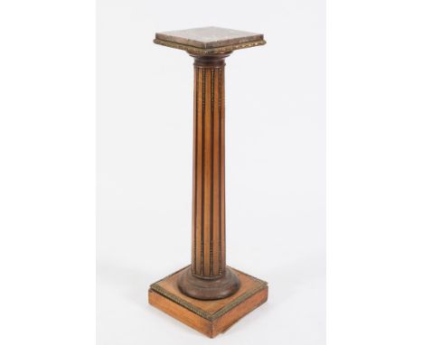 A French stained mahogany and brass mounted pedestal:, with rouge variegated marble top on fluted column and square base, 109