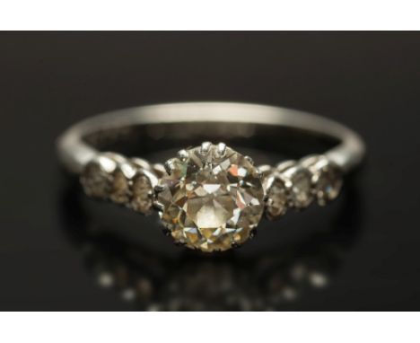 A diamond single stone ring: with old, brilliant-cut diamond approximately 0.75ct between diamond-set three-stone shoulders, 