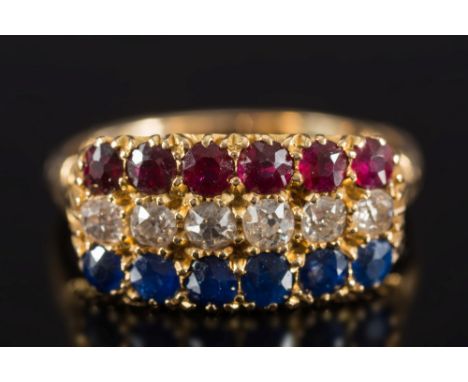 A late 19th/early 20th century gold, sapphire, ruby and diamond three-row cluster ring: with central row of round old brillia