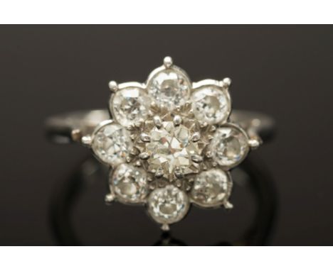 A diamond mounted cluster ring: mille-grain set with circular, brilliant-cut diamonds estimated to weigh a total of 1.70cts, 