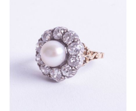 An 18ct Victorian diamond and Southsea pearl ring, measuring approx. 8.2mm in diameter, set as a cluster with ten old cut dia
