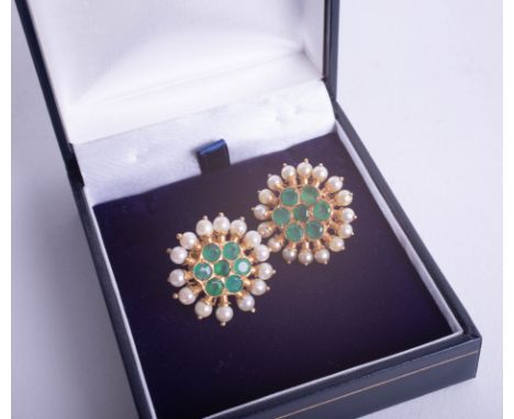 A pair of ornate Indian high carat gold emerald and pearl earrings.