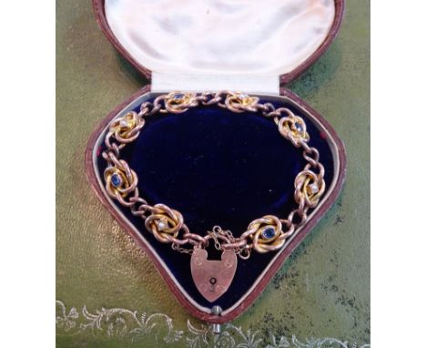 A 9ct antique gold bracelet set with sapphire and pearl with padlock and fitted cased, approx 18g.