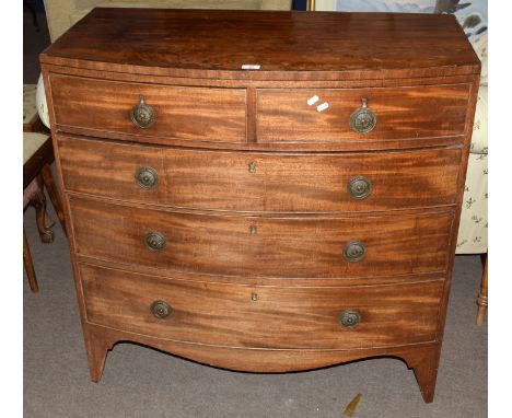 Late Georgian mahogany bow front chest of two and three drawers with replacement brass ring handles and raised on a shaped br