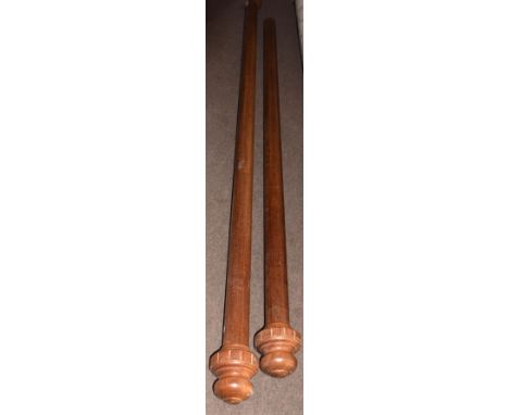 Two large mahogany curtain poles, with turned end finials, 280cm long, the other with one only turned end finial 240cm long, 