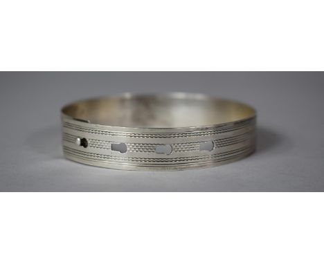 A Sterling Silver Bangle with Engine Turned Decoration 