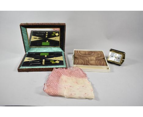 A 1950's Part Manicure Set, Travel Alarm Clock and a Handkerchief Pouch 