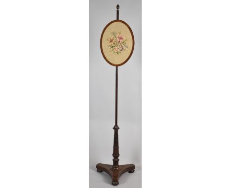 A Late 19th Century Mahogany Pole Screen with Triform Base and Rise and Fall Oval Tapestry Screen 