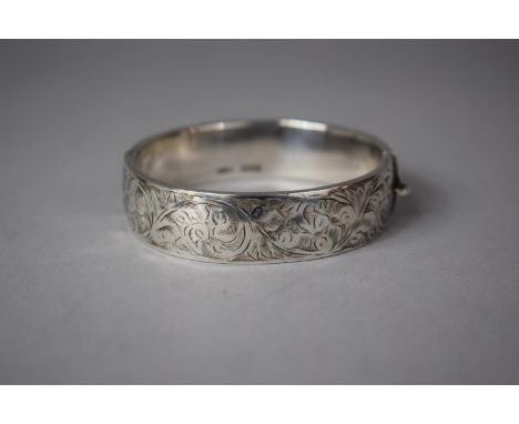 A Silver Bangle Hallmarked Birmingham 1959, Engraved Decoration and unusual safety bar