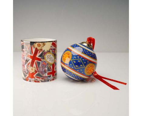 A distinctive 2-piece collectible set by Halcyon Days, featuring a fine bone china mug and a richly colored Christmas bauble.