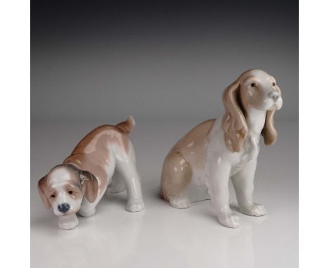 A delightful 2-piece set of Lladro porcelain dog figurines featuring model 6212 Little Hunter, a curious puppy with a lowered