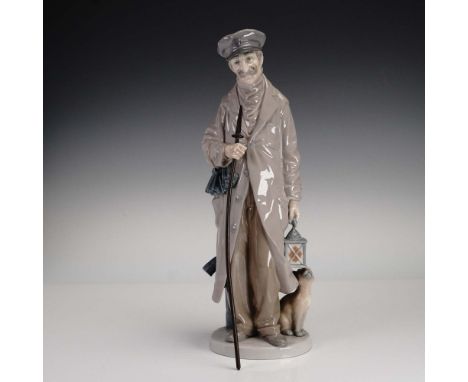 This Lladro porcelain figurine, model 1005087 titled The Nightwatchman, depicts a uniformed guard in a long overcoat holding 