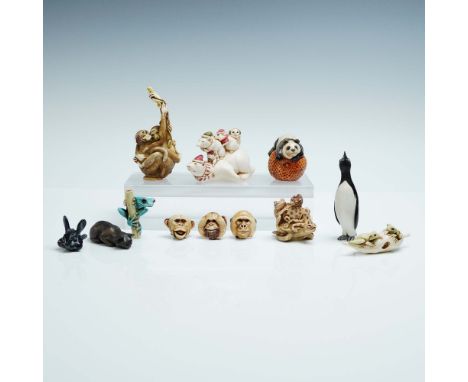 A delightful 10 piece assortment of collectible animal figurines featuring a whimsical variety of subjects including penguins
