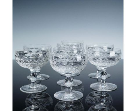 A sparkling set of eight Waterford crystal coupe-style glasses in the classic Colleen pattern, perfectly suited for serving c