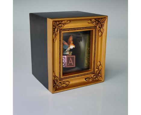 From the Walt Disney Showcase Collection by Enesco, this Gallery of Light diorama titled Pixie Laughter features Tinker Bell 