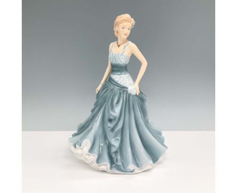 Elegant Royal Doulton bone china figurine titled Angela HN 5603. This hand-decorated piece features a graceful lady in a flow