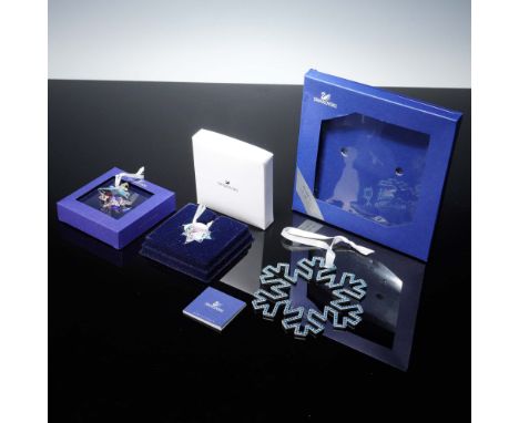 A festive collection of three crystal tree ornaments including Snowflake Small, Marshall Fields 20005 Great Tree exclusive, O