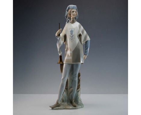 Glazed finish tall and early piece capturing a regal messenger standing with a brass trumpet at his side. Lladro backstamp. A
