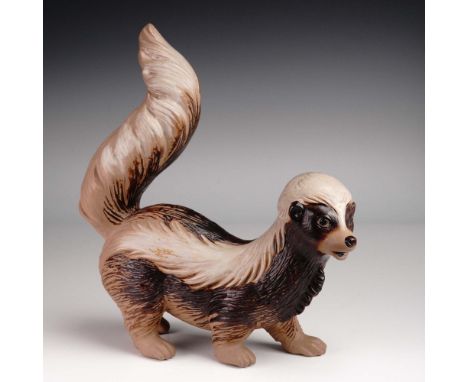 This charming Lladro porcelain figurine depicts a skunk rendered in a warm gres finish that beautifully accentuates the sculp