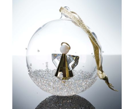 Annual edition Christmas ball featuring an eye catching clear crystal Christmas tree set within a hand blown glass globe. Acc