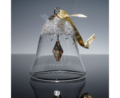 This Swarovski 2022 Exclusive Edition Dillard's Bell Ornament showcases the brand's signature precision-cut clear crystal wit
